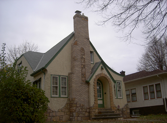A chimney we rebuilt to match the original design of the building incoporating new brick and matching stone.
