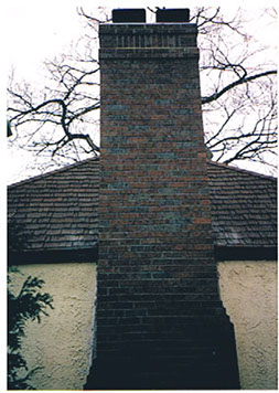 The chimney after we tore down the original to the ground and complete rebuilt a new chimney. We did not put stucco back on as it traps moisture