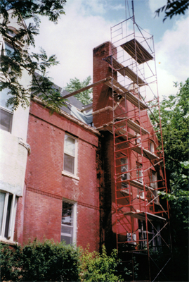 We set up scaffolding from the ground to transport materials and haul down brick from the old chimney.