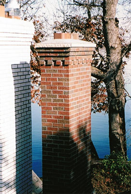Another view of the chimneys which allows you to see the cement cap that has a gradual slope making all water run down instead of pooling.